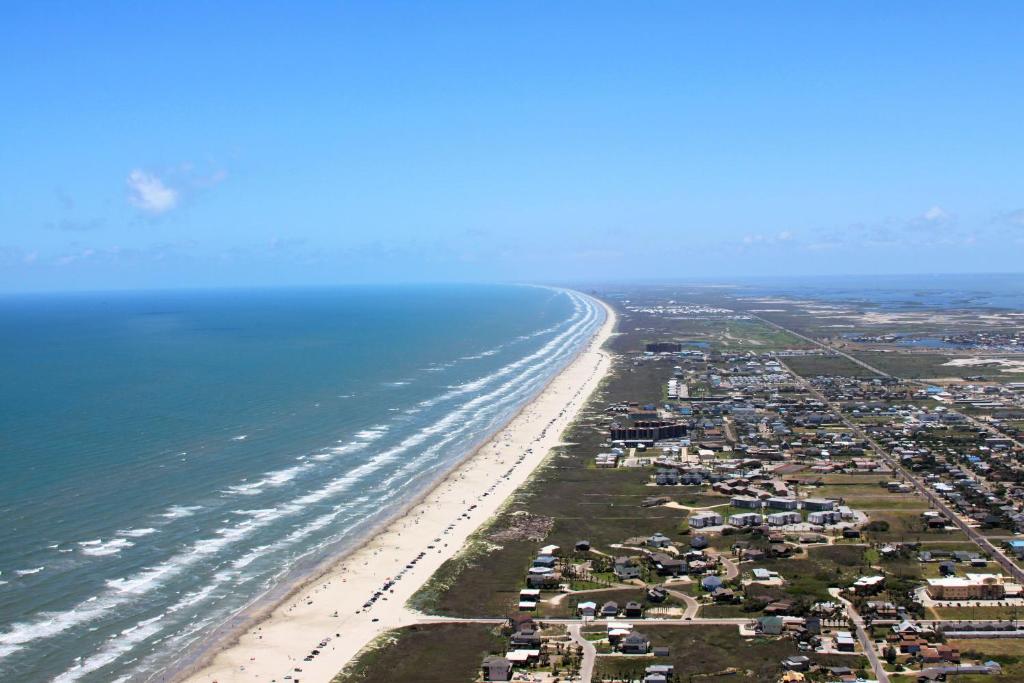 an aerial view of a beach with houses and the ocean at Popsicles and Flip Flops VW8 in Port Aransas