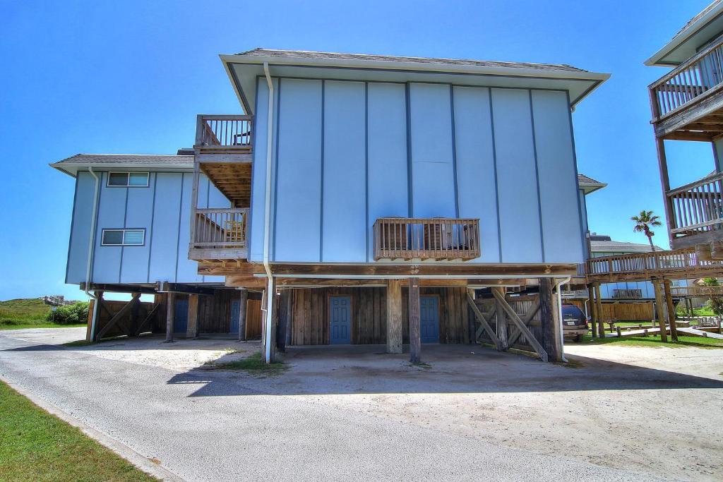 a blue building with balconies on the side of it at Picture Perfect View BH 308 in Port Aransas