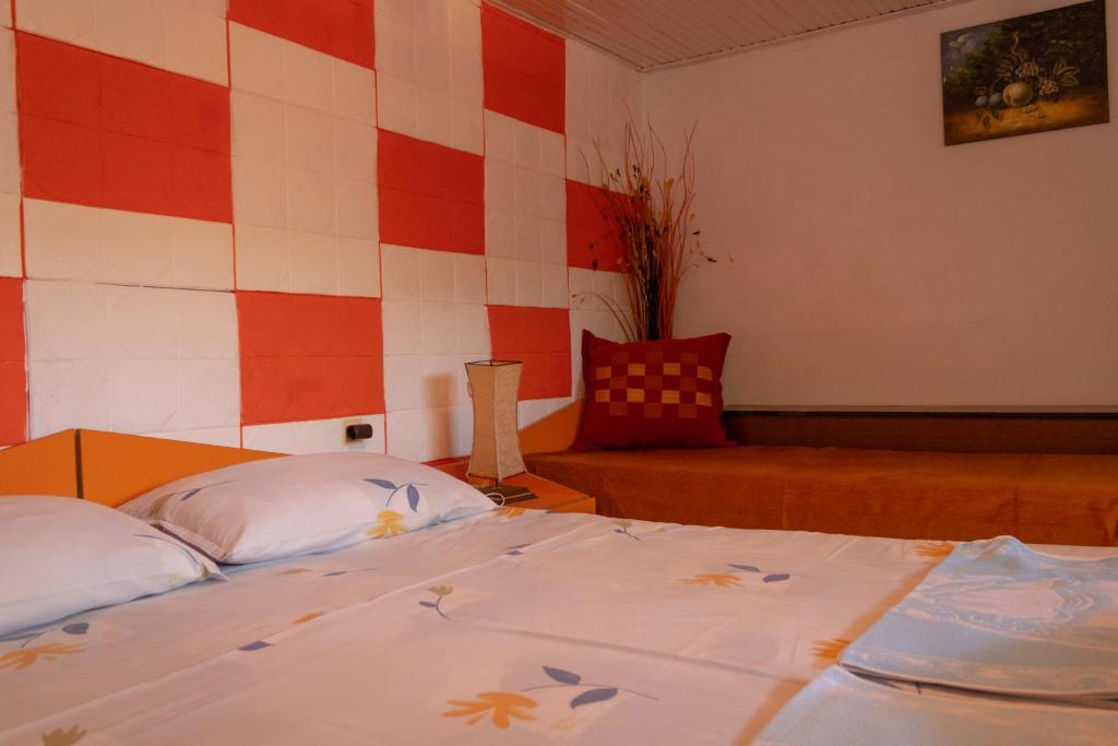 Postel nebo postele na pokoji v ubytování Rooms Molabeciri