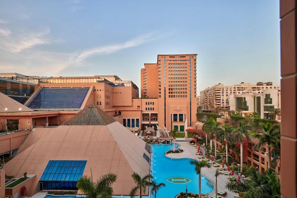 an aerial view of a city with a swimming pool at Intercontinental Cairo Citystars by IHG in Cairo