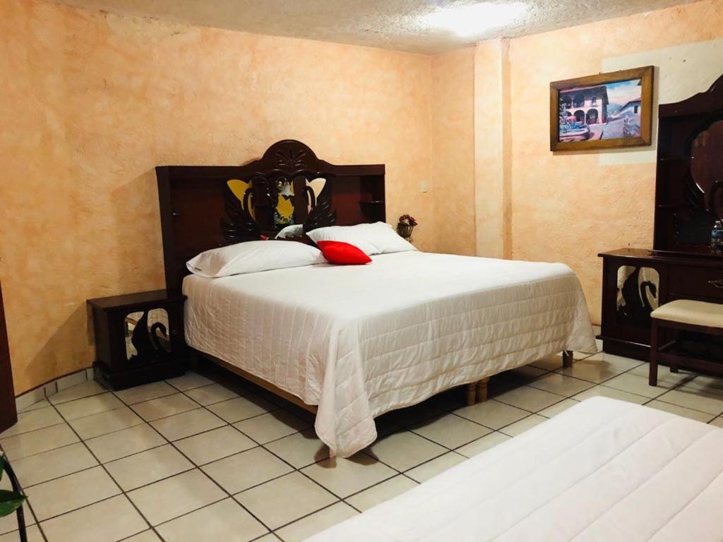 Postel nebo postele na pokoji v ubytování Hotel Fernando´s