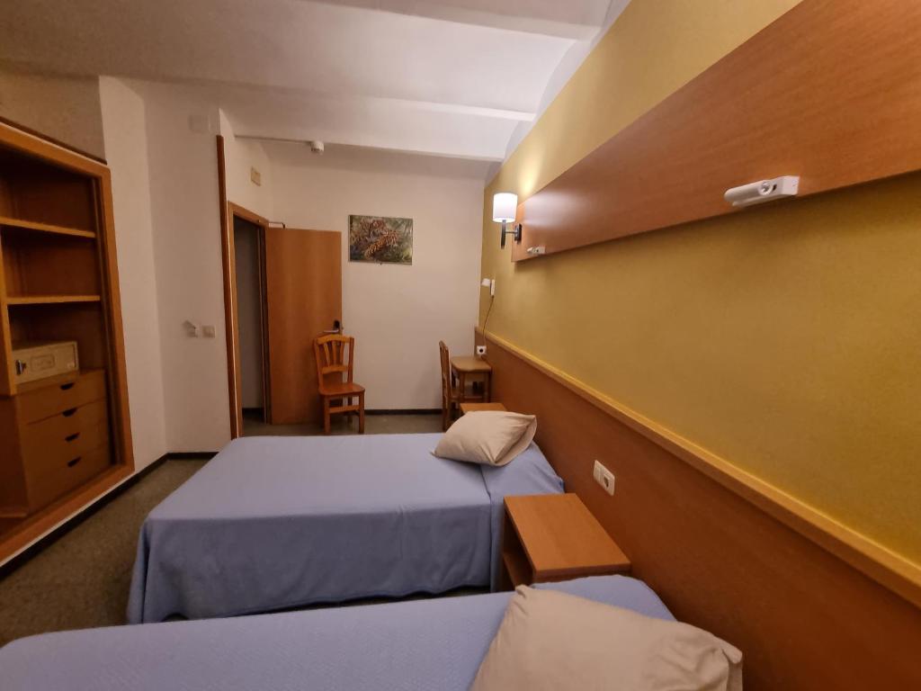 Postel nebo postele na pokoji v ubytování Pension El Ciervo