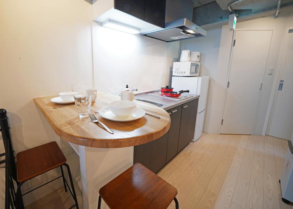Kuchyň nebo kuchyňský kout v ubytování Laffitte Hirai Condominium Hotel