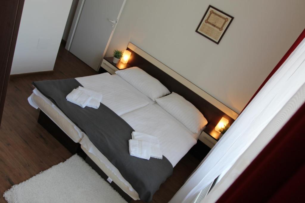 Postel nebo postele na pokoji v ubytování Residence Vysta
