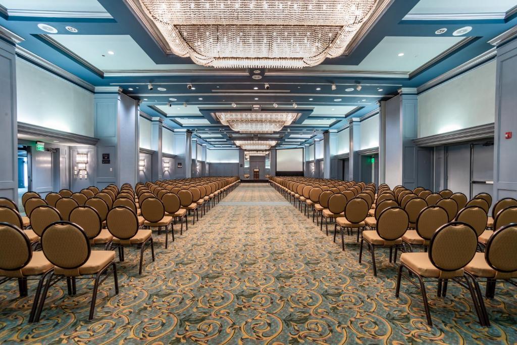 a row of chairs in a large room with blue ceilings at Menger Hotel in San Antonio