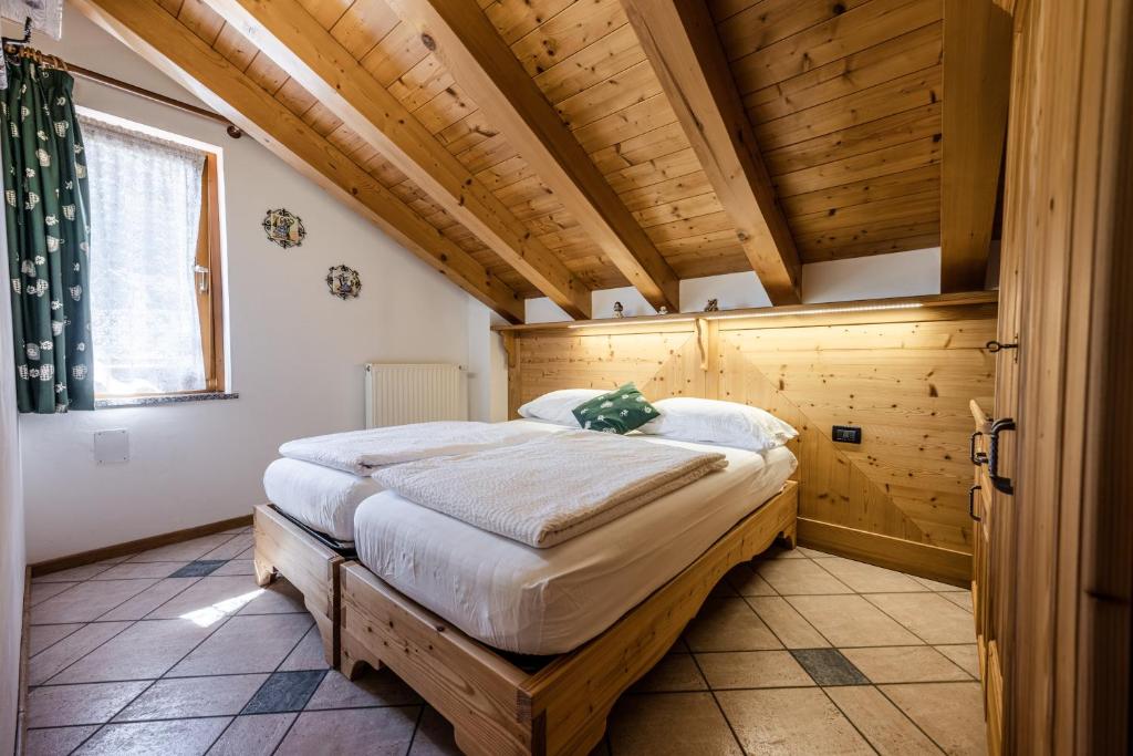 Postel nebo postele na pokoji v ubytování Villetta Val Di Sole