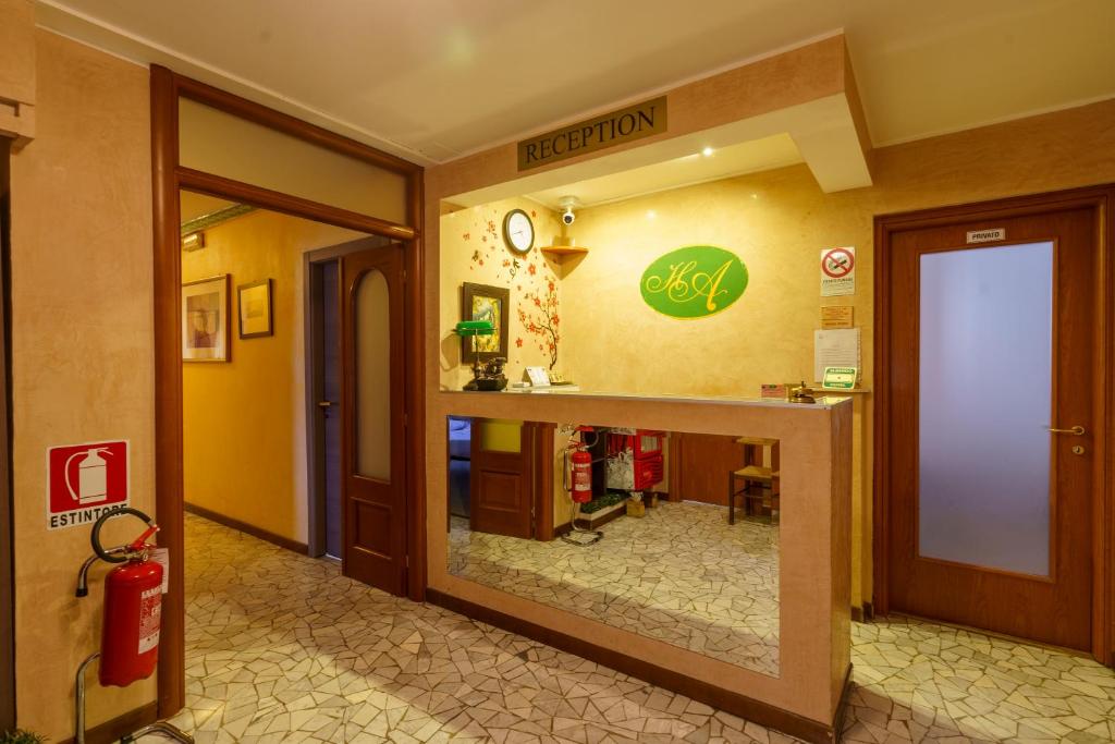 a hospital lobby with a reflection in the window at Hotel America in Milan