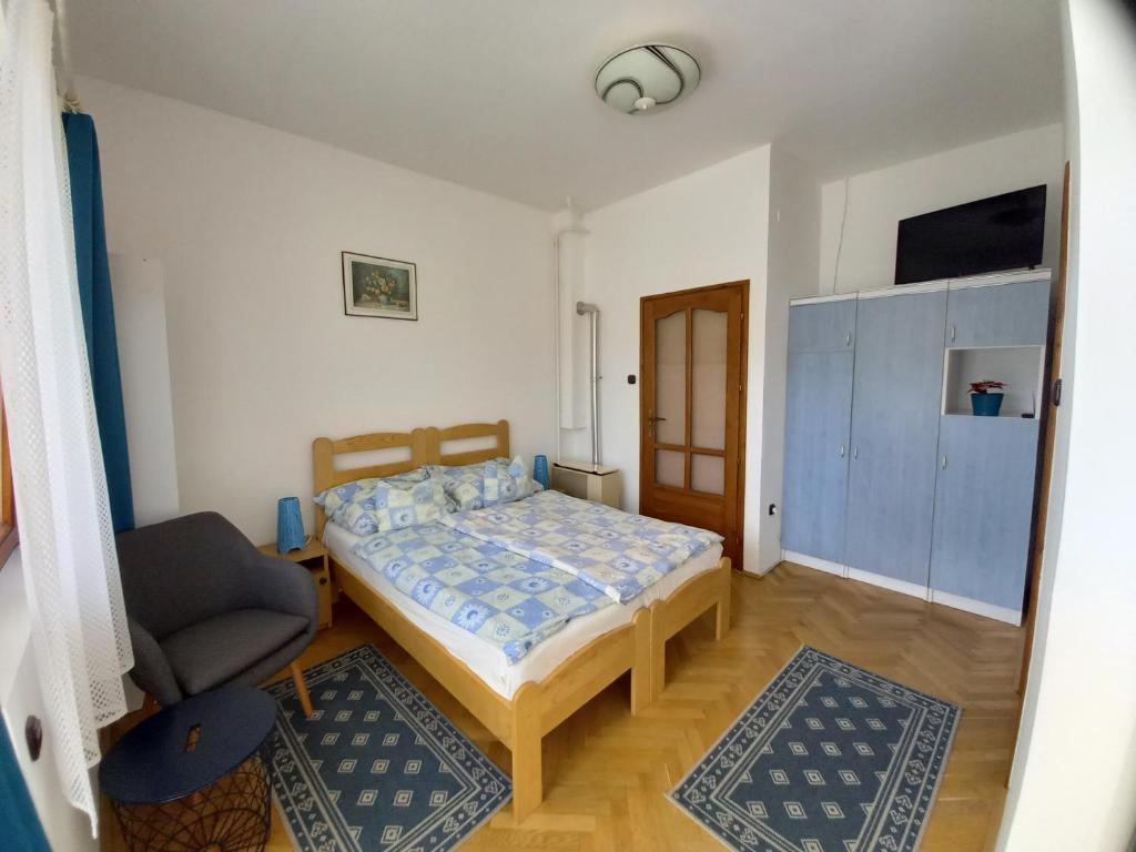 Posteľ alebo postele v izbe v ubytovaní Kispál Apartmanház