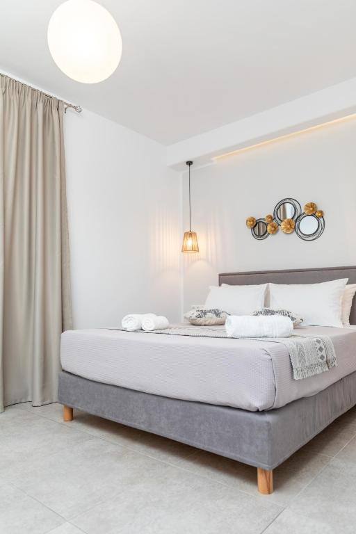 a bedroom with a large bed in a room at Dolce Vita appartments in Naxos Chora