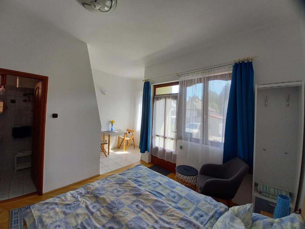 Posteľ alebo postele v izbe v ubytovaní Kispál Apartmanház