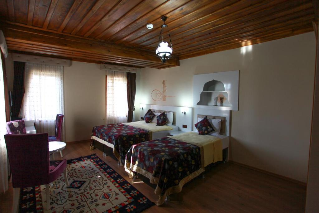 Postel nebo postele na pokoji v ubytování Bacchus Pension