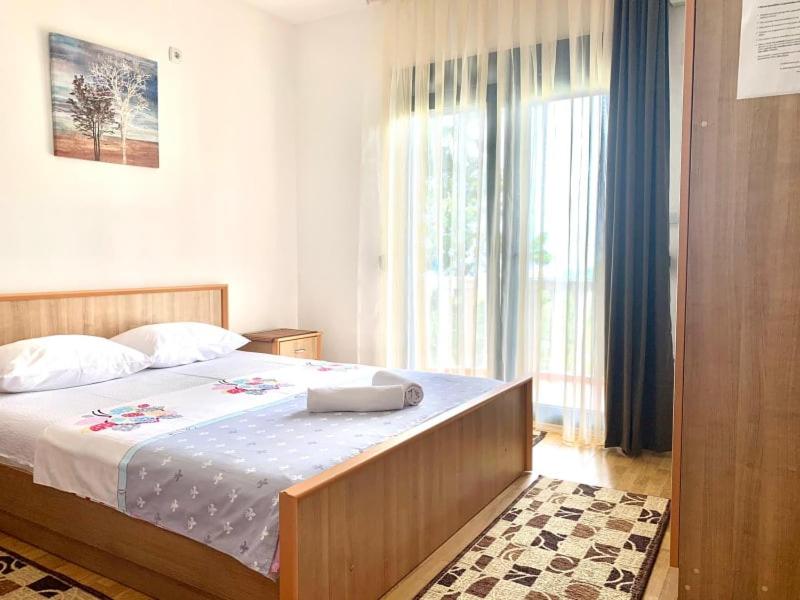 Postel nebo postele na pokoji v ubytování Beqa Apartments