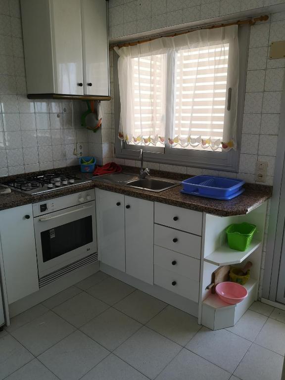 Kuchyň nebo kuchyňský kout v ubytování Apartamento Padoa playa