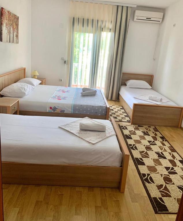 Postel nebo postele na pokoji v ubytování Beqa Apartments