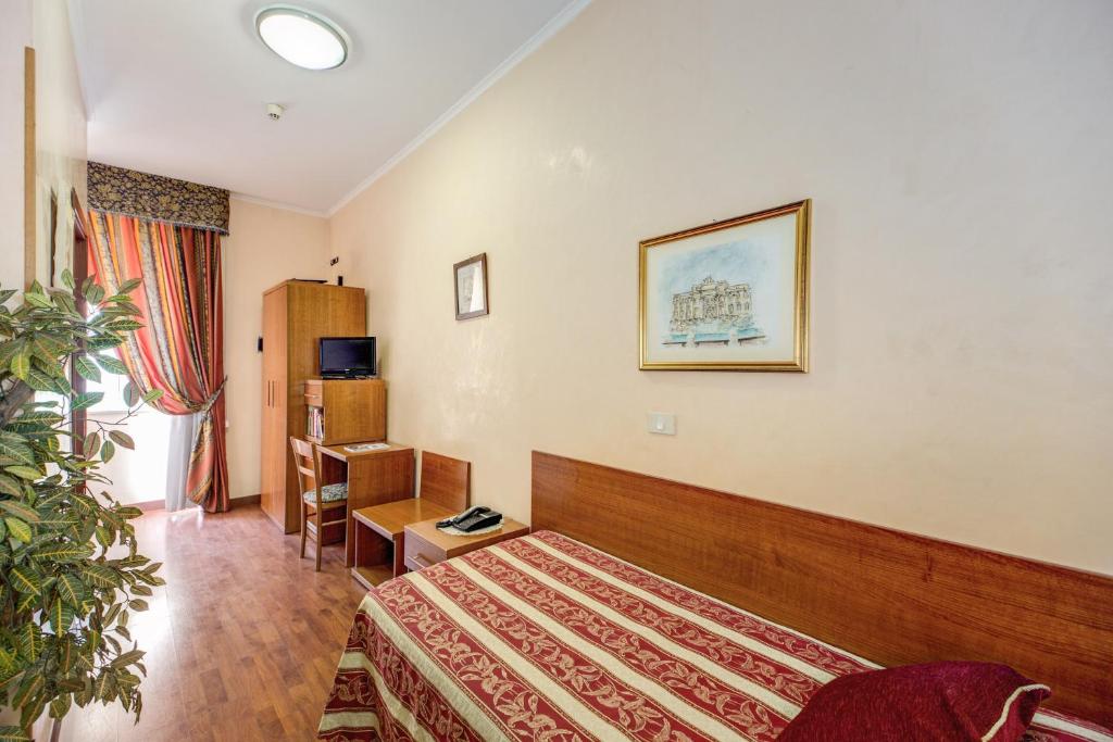 Postel nebo postele na pokoji v ubytování Buonarroti Home