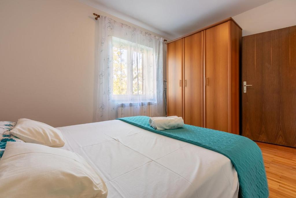 Łóżko lub łóżka w pokoju w obiekcie House Vicky