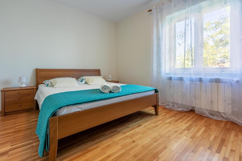 Łóżko lub łóżka w pokoju w obiekcie House Vicky