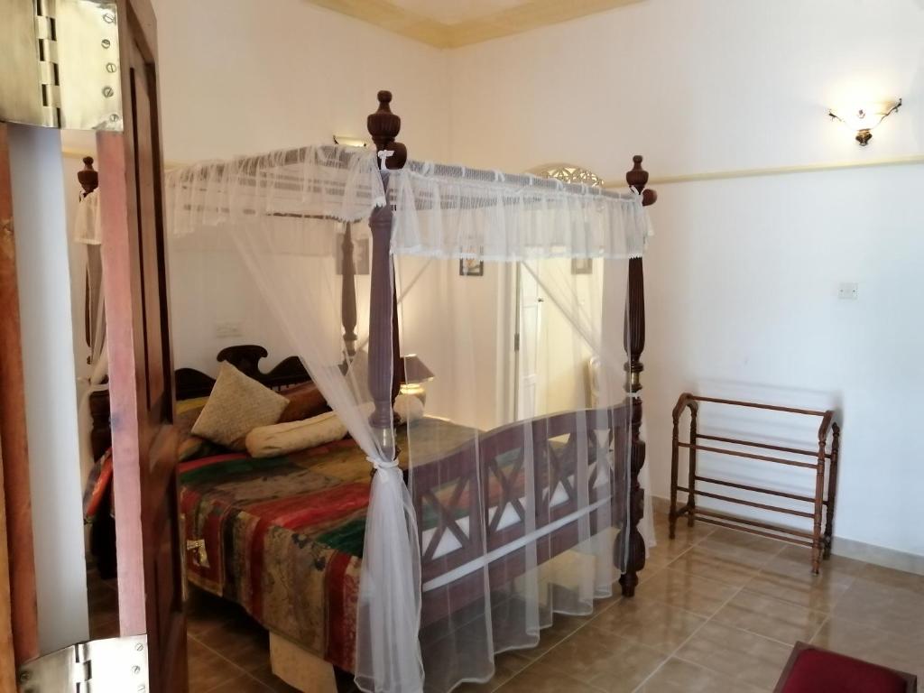 Postel nebo postele na pokoji v ubytování Manor House-Kandy