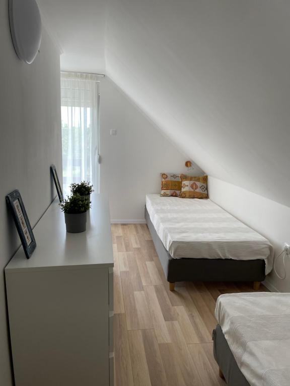 Posteľ alebo postele v izbe v ubytovaní Bogi House
