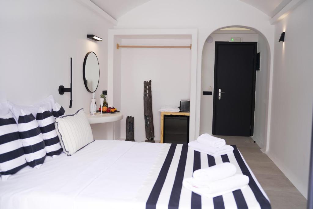 Postel nebo postele na pokoji v ubytování King's Suites