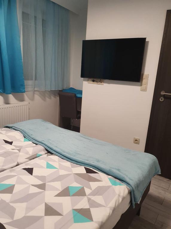 Posteľ alebo postele v izbe v ubytovaní Dévai-LUX Apartman Sárvár
