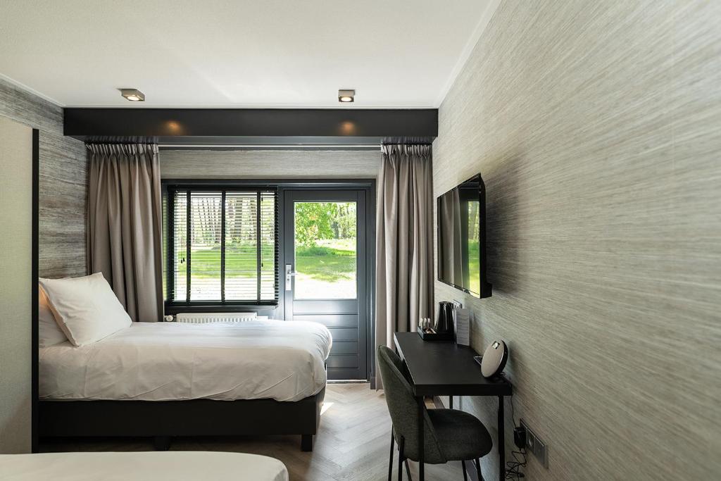 TV a/nebo společenská místnost v ubytování Hotel de Werelt