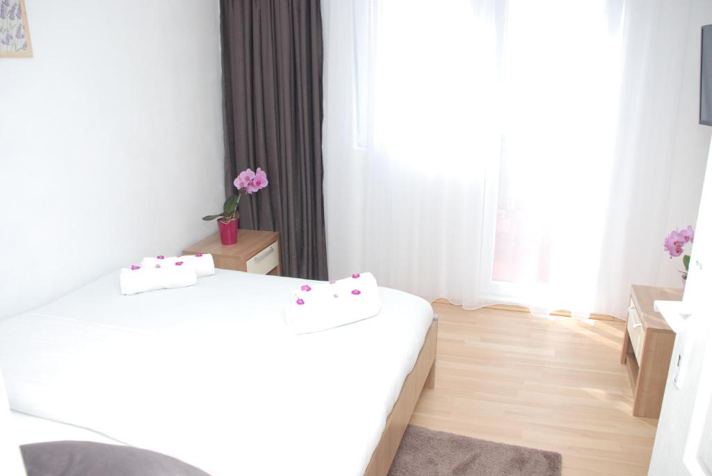 Postel nebo postele na pokoji v ubytování Apartment Danubius