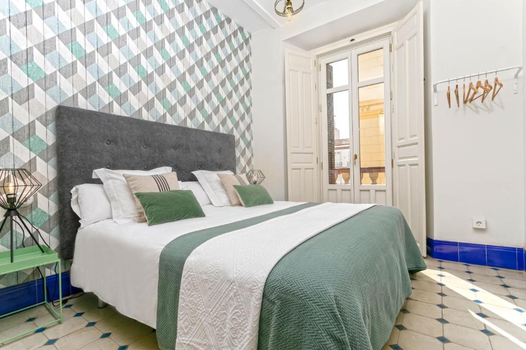 Posteľ alebo postele v izbe v ubytovaní Genteel Home Cervantes