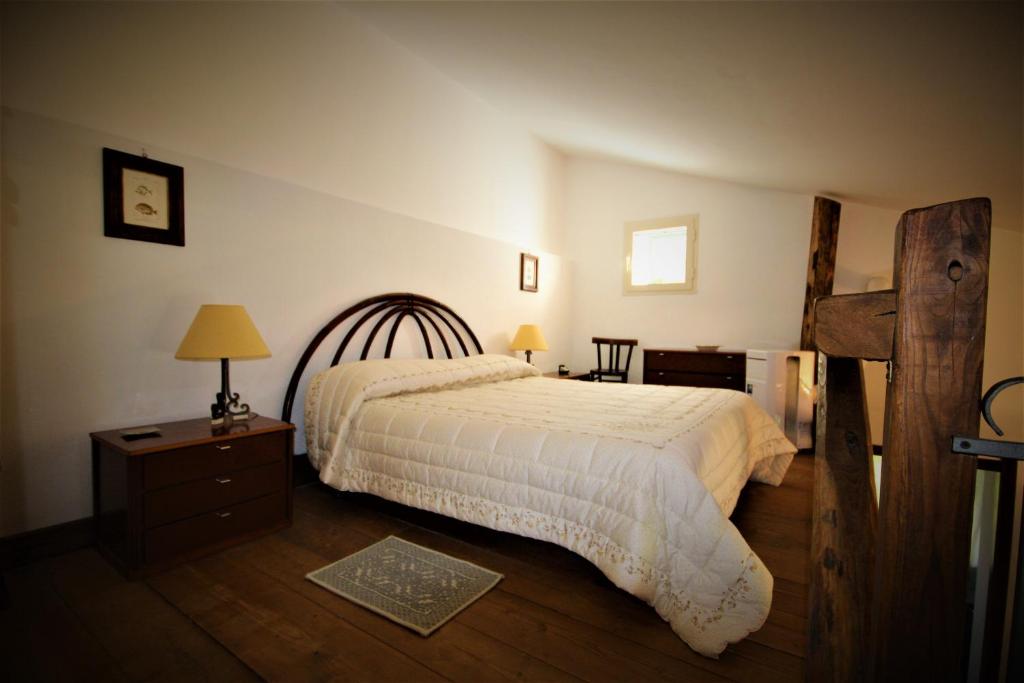 Un pat sau paturi într-o cameră la La Tinaia