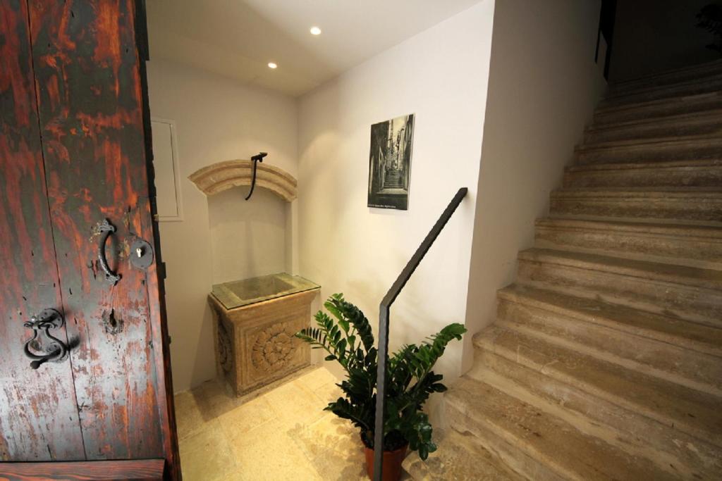 a room with a staircase leading to a staircase at Nije Preša Apartments in Dubrovnik