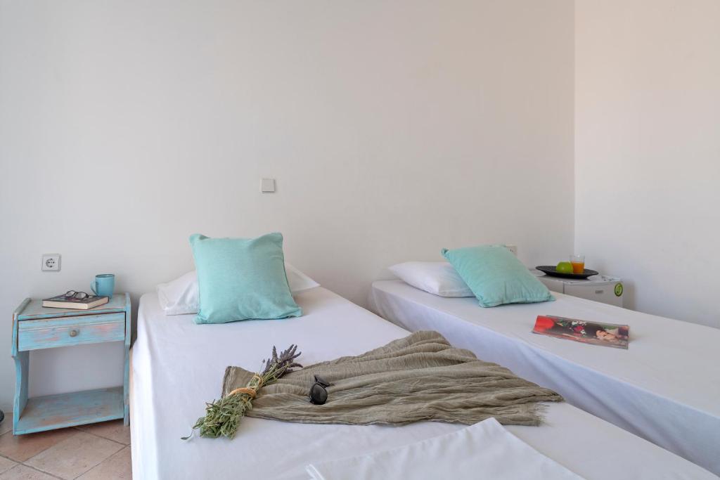 Łóżko lub łóżka w pokoju w obiekcie Eco Beachfront Villa