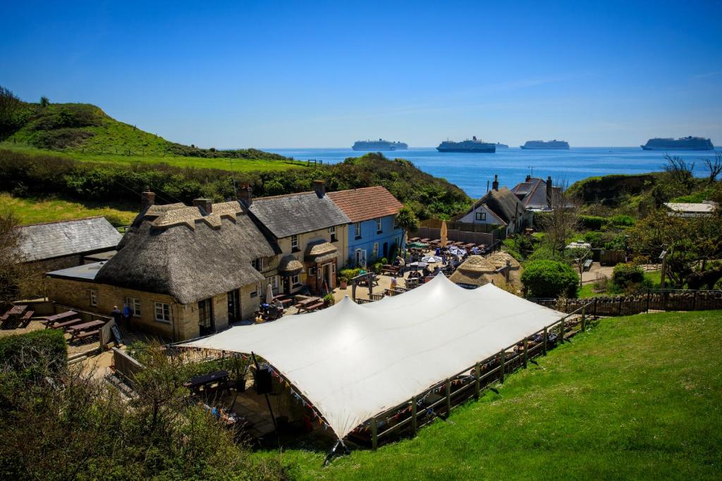 an aerial view of a house with a white tent at The Smugglers Inn in Weymouth