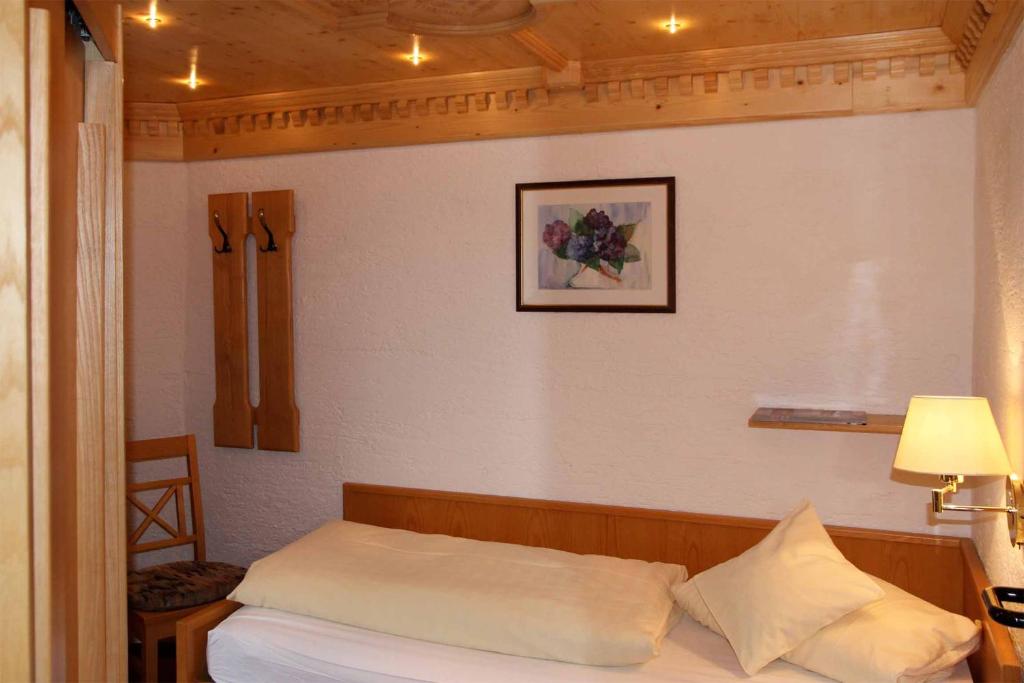 Postel nebo postele na pokoji v ubytování Hotel Mariandl - Singender Wirt
