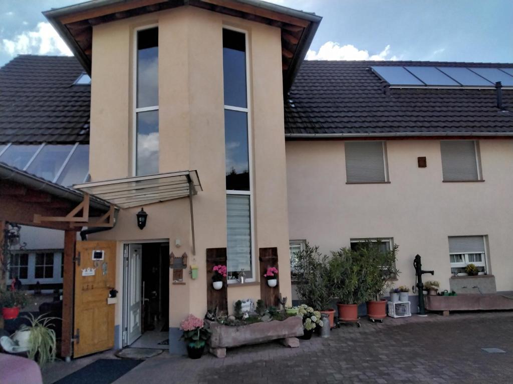 a house with solar panels on the roof at Fewo Jehle Süd Nord in Rust