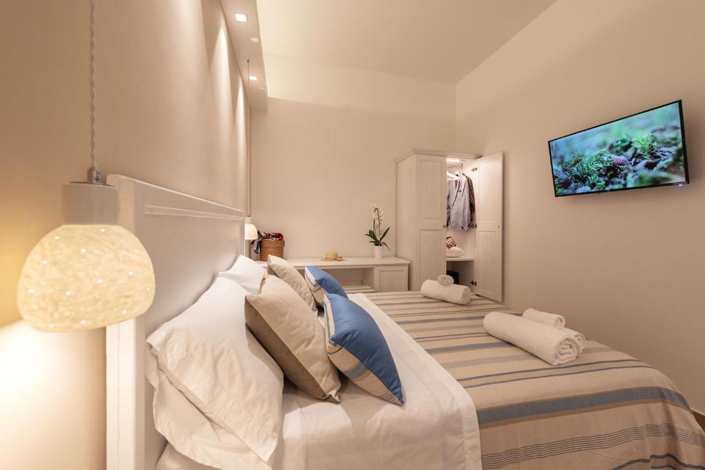 Łóżko lub łóżka w pokoju w obiekcie B&B Il Cortiletto