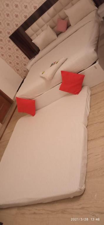 Postel nebo postele na pokoji v ubytování Viraj Guest House