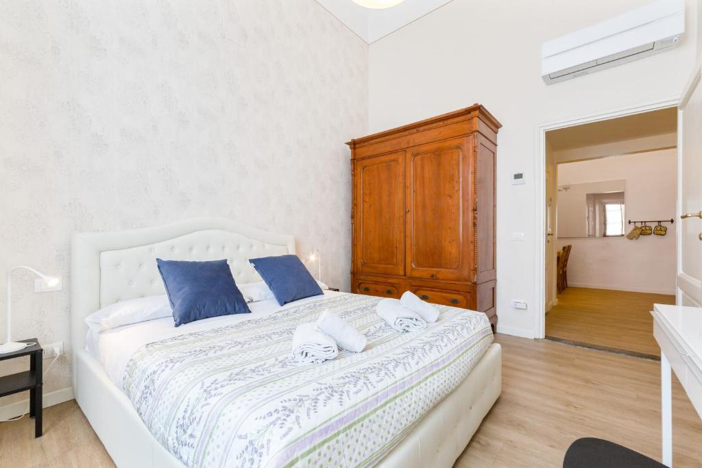 Posteľ alebo postele v izbe v ubytovaní I Renai - Ponte delle Grazie Modern Apartment