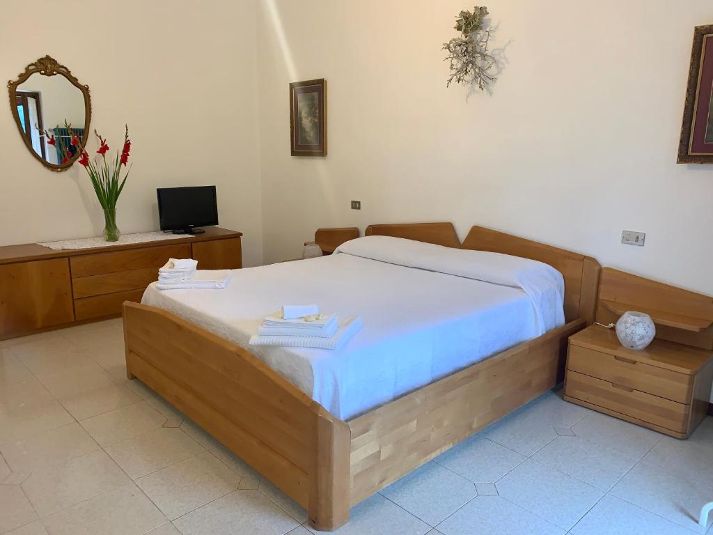 Postel nebo postele na pokoji v ubytování Reginaldo's home