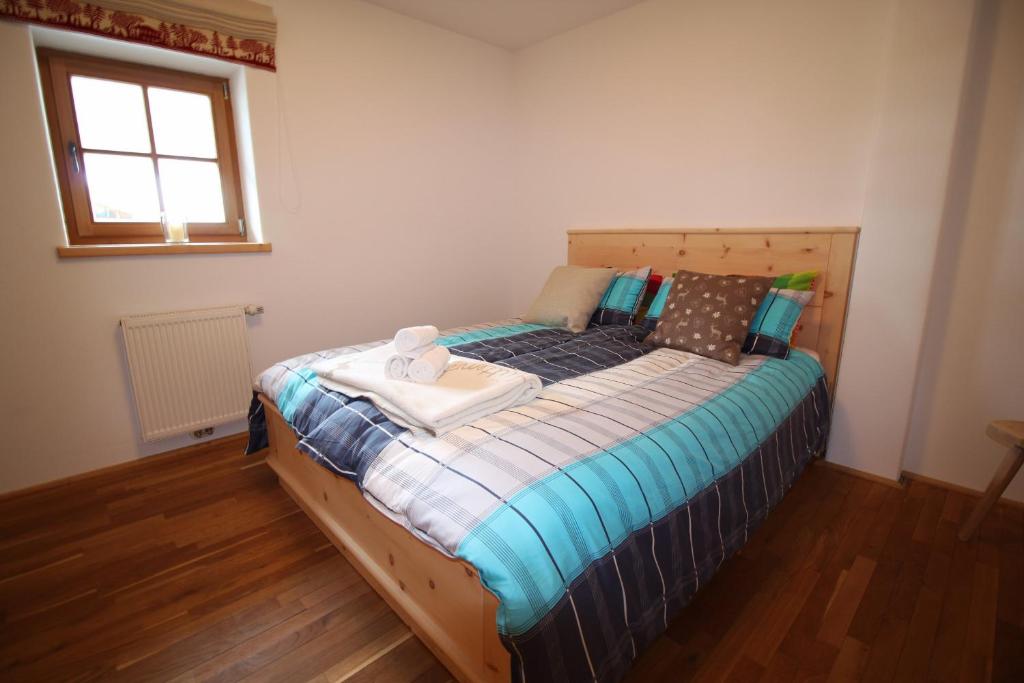 A bed or beds in a room at Apartment Jochberg by Apartment Managers