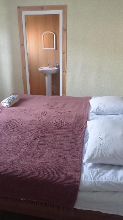 Postel nebo postele na pokoji v ubytování Guesthouse Omalo