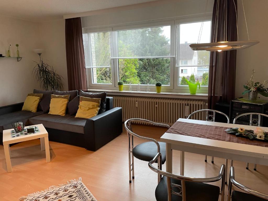 a living room with a couch and a table at Fewo Weser in Holzminden