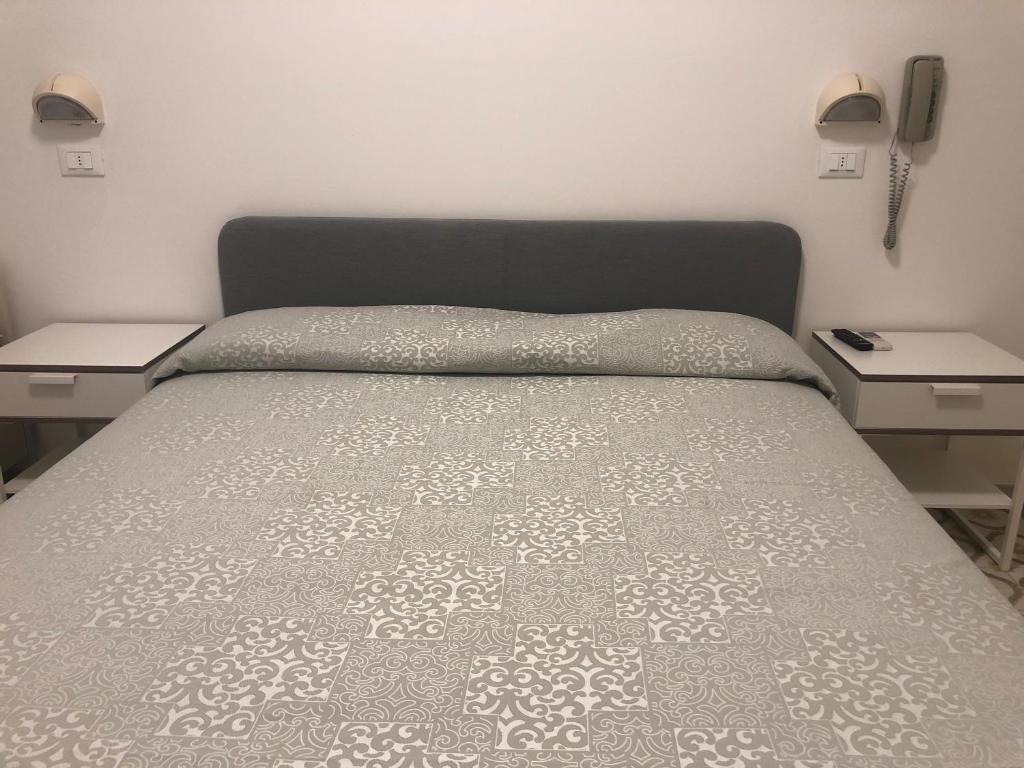 Postel nebo postele na pokoji v ubytování Hotel Calypso