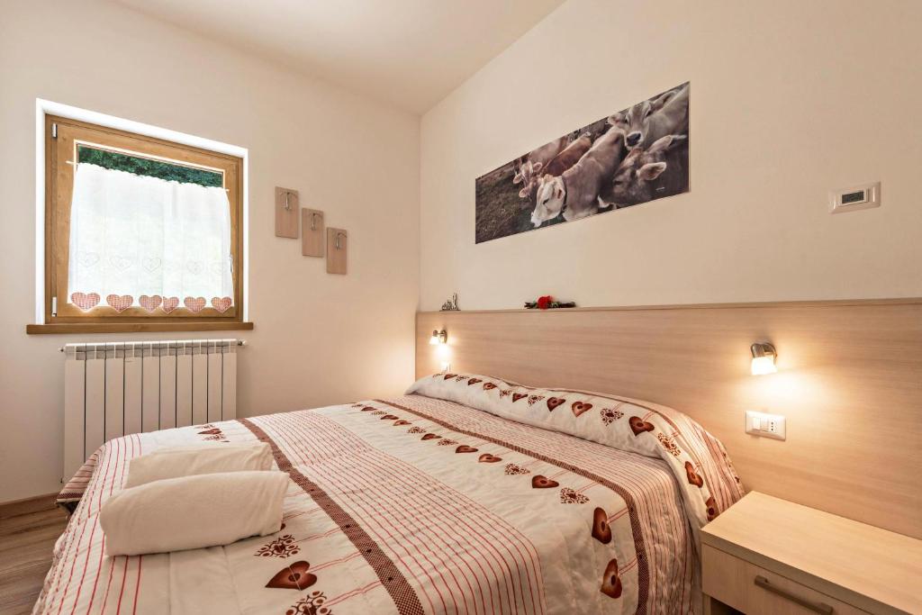 Postel nebo postele na pokoji v ubytování Nonno Bigi Papavero
