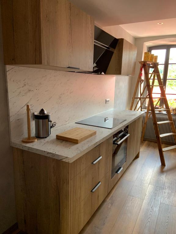 Kuchyň nebo kuchyňský kout v ubytování Les Chambres - Au Grès du marché