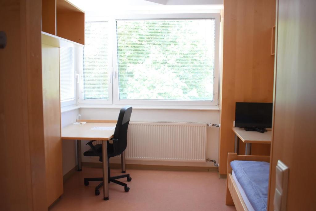 TV a/nebo společenská místnost v ubytování SOVEA Hotel - City