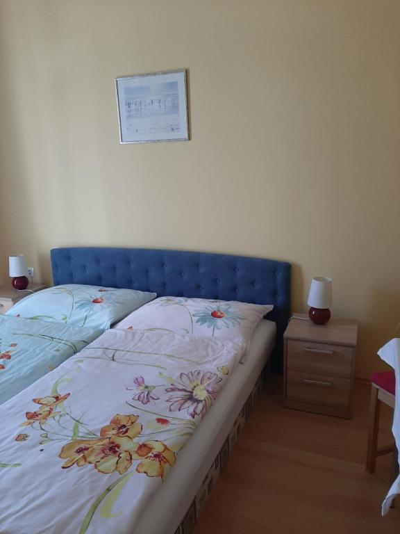 Posteľ alebo postele v izbe v ubytovaní Kondics Apartmanház