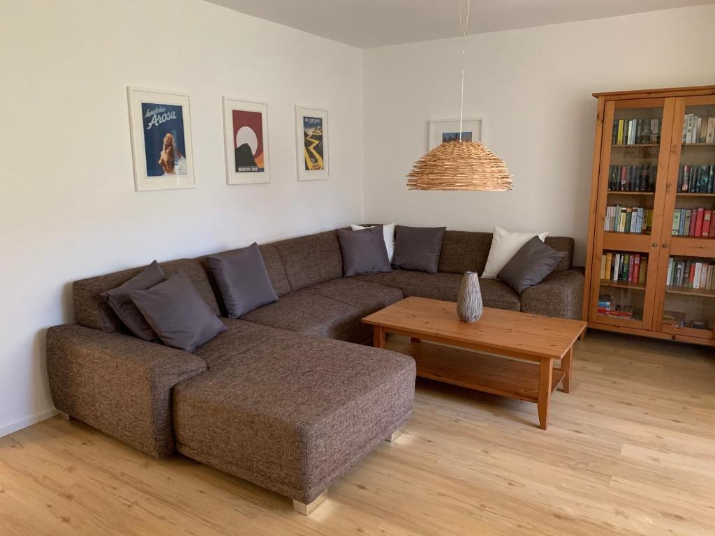 a living room with a couch and a coffee table at Casa Mika in Konstanz