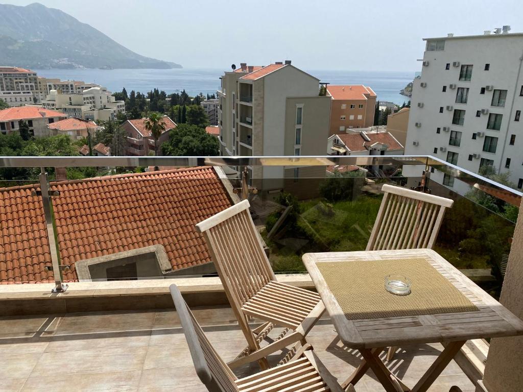 a patio with two chairs and a table on a balcony at Apartment Iva in Boreti