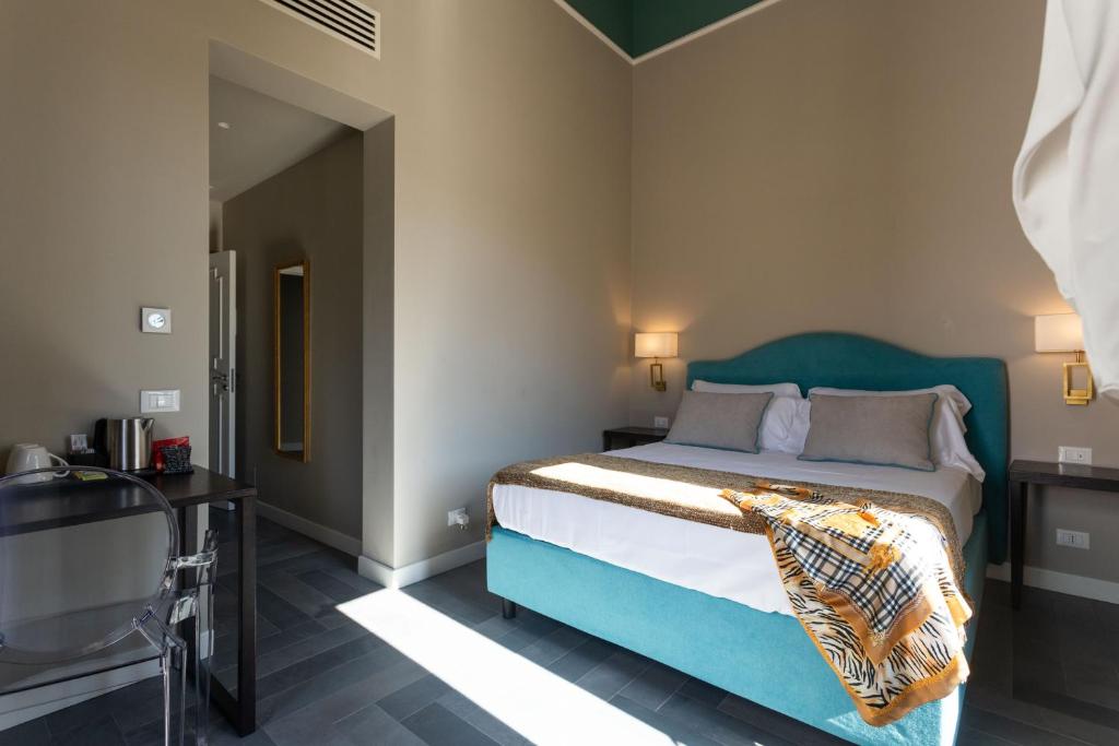Postel nebo postele na pokoji v ubytování Villa Masetta - Luxury Suites