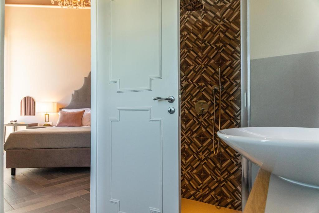 Postel nebo postele na pokoji v ubytování Villa Masetta - Luxury Suites